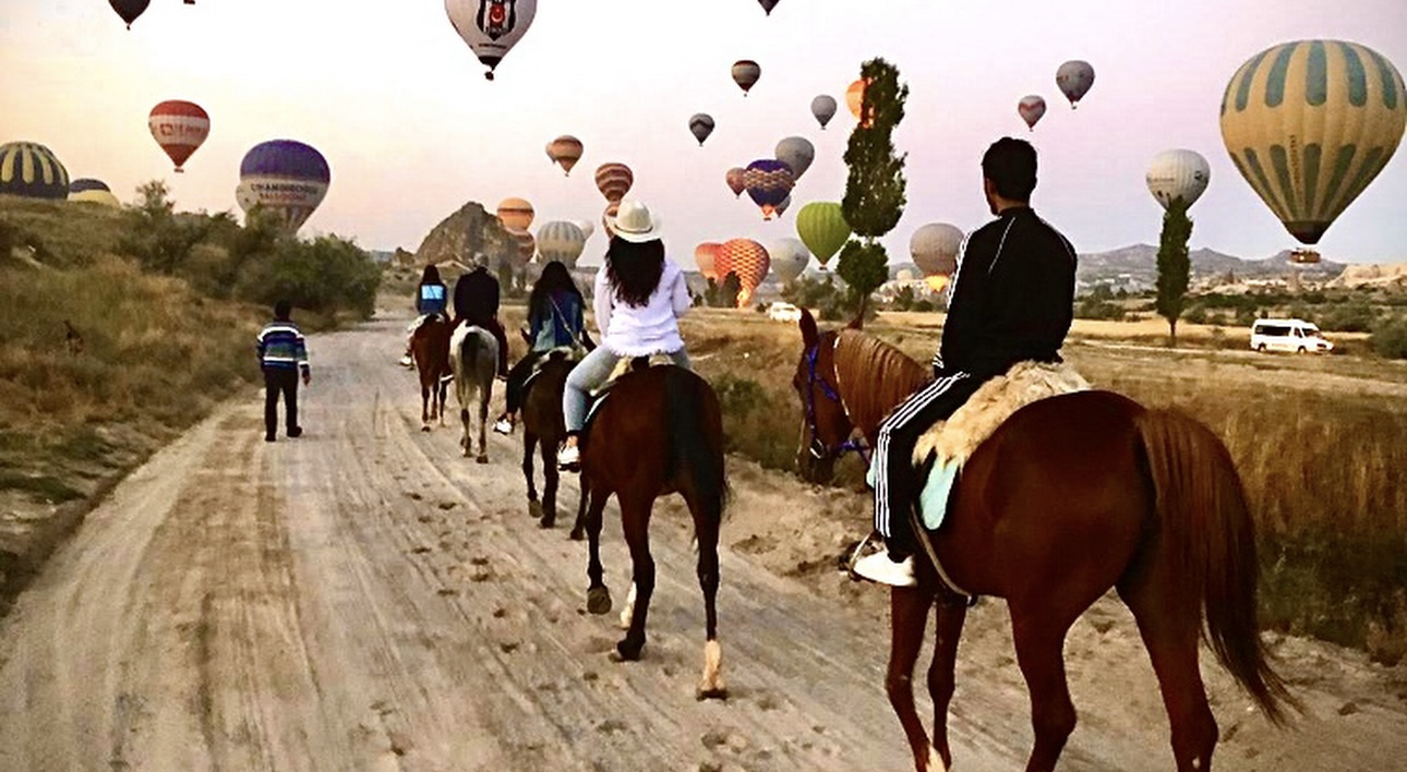 Riders at sunrise among the fairy chimneys
